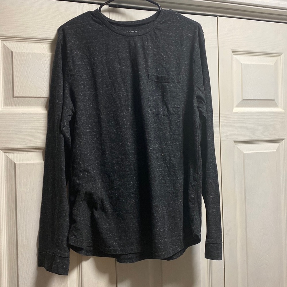 Black long sleeved t shirt with single pocket